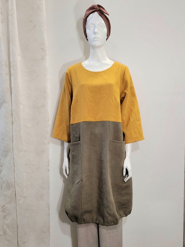 Linnekl&auml;nning med stora fickor.